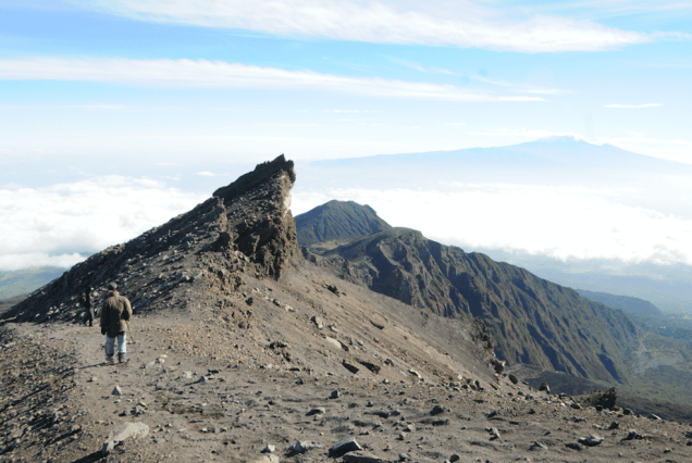 Mount Meru claims its position as the second highest peak in Tanzania, gracing the pristine landscapes of Arusha National Park