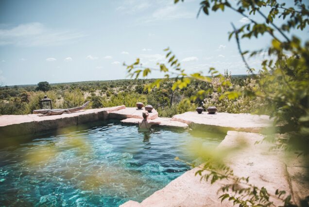 5 Nights Luxury Tanzania Safari / Fly Back from Serengeti - man and woman in swimming pool during daytime